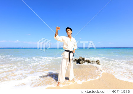 Men training on a beautiful tropical country beach 40741926