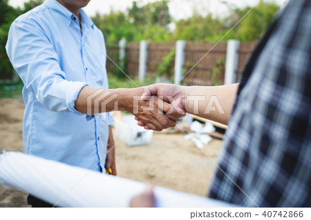 Shaking hands of partnership agreement engineer. 40742866