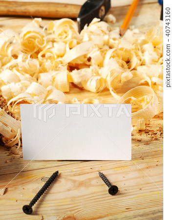 Business card on wooden table for carpenter tools with sawdust. 40743160