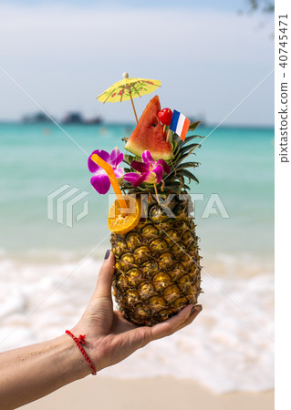 Pineapple coctail in a woman's  40745471