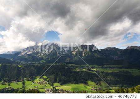 Paraglider flying over Dachstein Alps, Austria 40746778