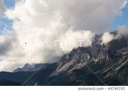 Paraglider flying over Dachstein Alps, Austria Paraglider flying over Dachstein Alps, Austria 40746785