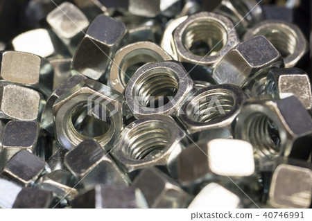shiny metal nuts lie in the pile. Background. shiny metal nuts lie in the pile. Background. 40746991