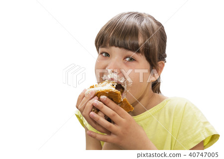Girl eating cake. Isolated on white background. 40747005