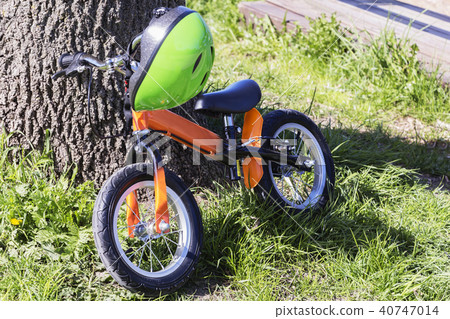 running and helmet near the tree in the forest.  40747014