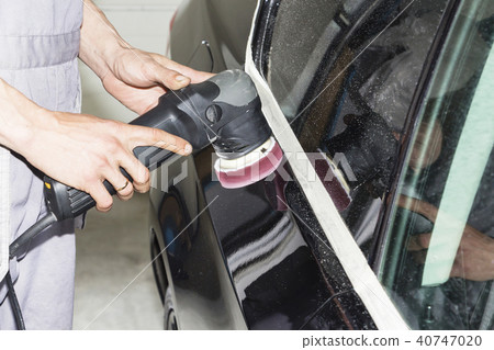Car detailing - Hands with orbital polisher Car detailing - Hands with orbital polisher 40747020