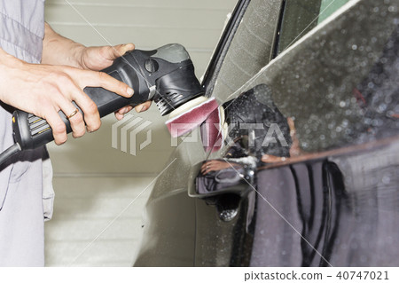 Car detailing - Hands with orbital polisher Car detailing - Hands with orbital polisher 40747021
