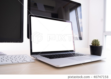 Laptop with blank screen on table. Workspace  40747158