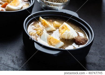 The sour soup made of rye flour with eggs The sour soup made of rye flour with eggs 40747745