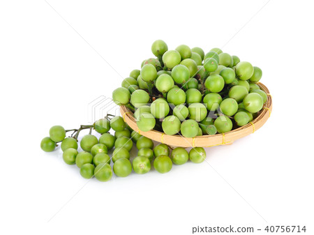 fresh pea eggplant in bamboo basket and on white 40756714