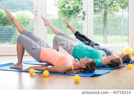 Women doing exercises for pelvis floor in postnatal course Women doing exercises for pelvis floor in postnatal course 40758214