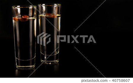 aromatic anise alcohol with coffee beans in glass aromatic anise alcohol with coffee beans in glass 40758607