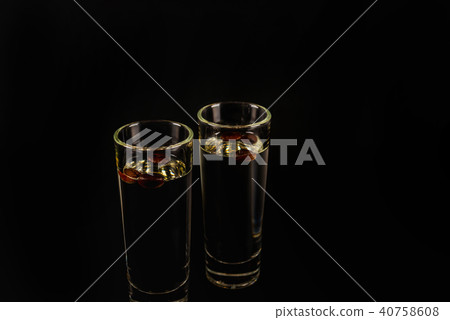 aromatic anise alcohol with coffee beans in glass aromatic anise alcohol with coffee beans in glass 40758608