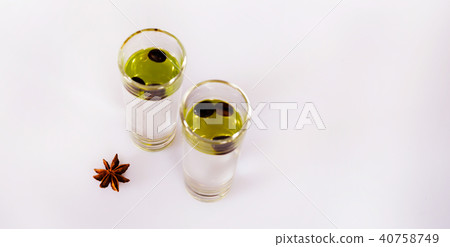aromatic anise alcohol with coffee beans in glass aromatic anise alcohol with coffee beans in glass 40758749
