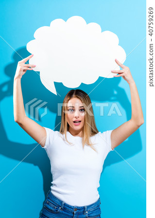 Young woman holding a speech bubble Young woman holding a speech bubble 40759269