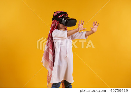 Arabian happy boy with virtual reality glasses 40759419