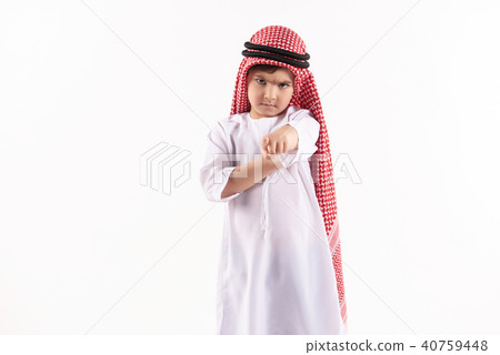 Arab disgruntled boy in keffiyeh points finger Arab disgruntled boy in keffiyeh points finger 40759448