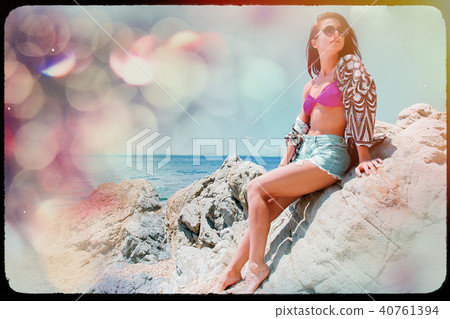 Young beautiful girl in bikini on the beach Young beautiful girl in bikini on the beach 40761394