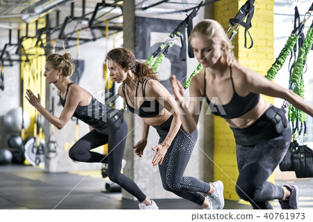 Sportive girls training in gym Sportive girls training in gym 40761973