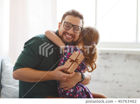 Father's day. Happy family daughter hugs his dad 40763402