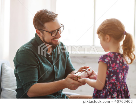 Father's day. Happy family daughter hugs his dad 40763403