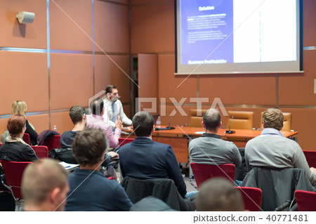 Skiled Public Speaker Giving a Talk at Business Meeting. Skiled Public Speaker Giving a Talk at Business Meeting. 40771481