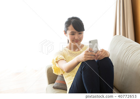 Junior high school student playing with a smartphone 40772653