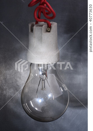 Light bulb on dark background 40773630