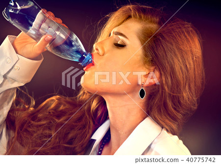 Sensitive teeth woman drinking cold water from bottle. Sudden toothache. Sensitive teeth woman drinking cold water from bottle. Sudden toothache. 40775742