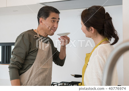 Japanese middle senior couple standing in the kitchen Japanese middle senior couple standing in the kitchen 40776974