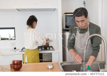 Husband who helps with domestic wife and cooking wife Husband who helps with domestic wife and cooking wife 40777121