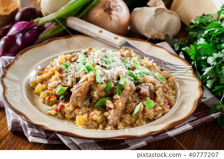 Risotto with champignon mushrooms and pork 40777207