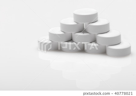 white pills on blue background white pills on blue background 40778021
