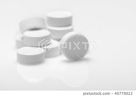 white pills on blue background 40778022