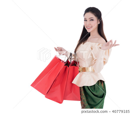 woman in Thai traditional dress holding a shopping bag isolated 40779185
