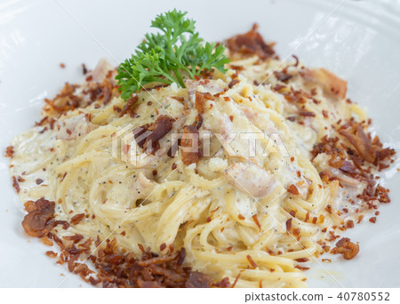 Spaghetti Carbonara on a wood table Spaghetti Carbonara on a wood table 40780552