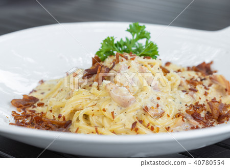 Spaghetti Carbonara on a wood table Spaghetti Carbonara on a wood table 40780554