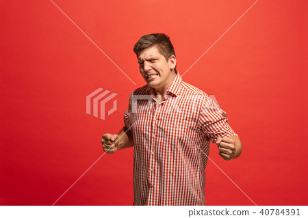 Winning success man happy ecstatic celebrating being a winner. Dynamic energetic image of male model 40784391