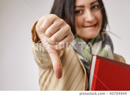 business woman showing her finger down business woman showing her finger down 40784944