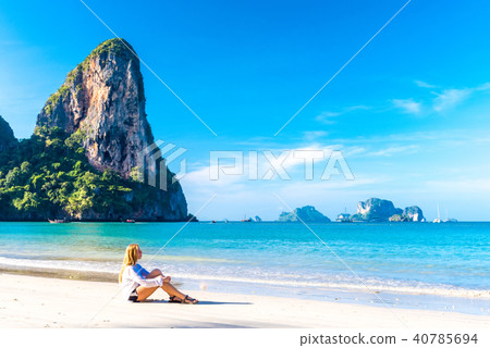 Woman resting on Railay beach Krabi Thailand. Asia 40785694
