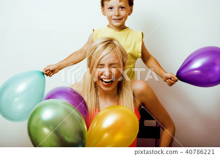 pretty real family with color balloons on white background, blon 40786221