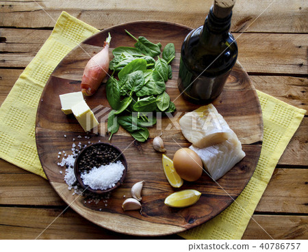 fish, spinach and egg salad on a dark background, top view. Delicious healthy food concept 40786757
