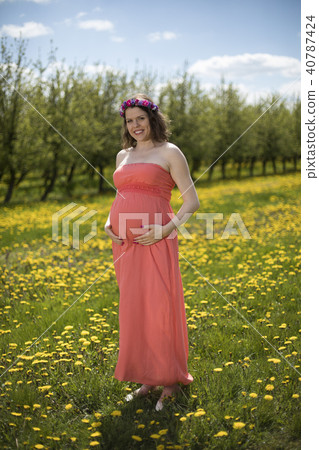 Spring, Young beautiful pregnant woman Spring, Young beautiful pregnant woman 40787424