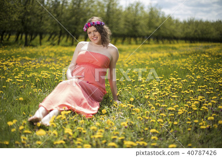 Pregnant woman in the meadow 40787426