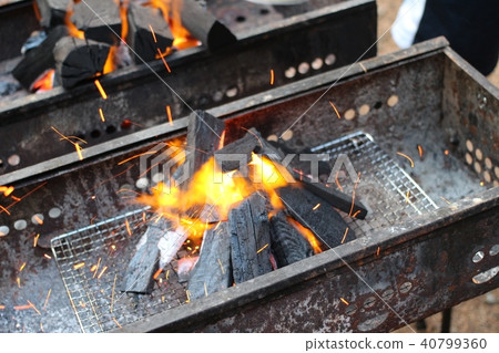 The first job at BBQ is to start the fire. The first job at BBQ is to start the fire. 40799360