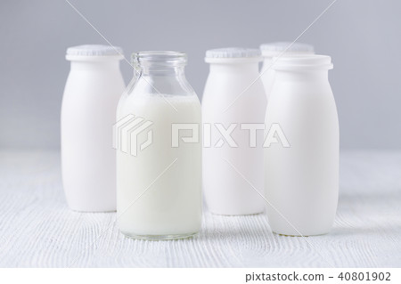 bottles of drink yogurt, glass and plastic bottles of drink yogurt, glass and plastic 40801902