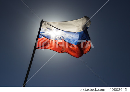 russian flag flying in slow motion and back lit by the sun. russian flag flying in slow motion and back lit by the sun. 40802645