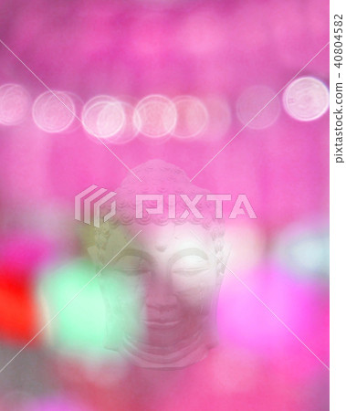 Buddha head and pink blurry light Buddha head and pink blurry light 40804582