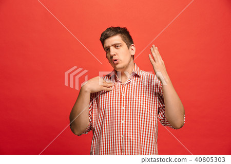 Beautiful male half-length portrait isolated on red studio backgroud. The young emotional surprised Beautiful male half-length portrait isolated on red studio backgroud. The young emotional surprised 40805303