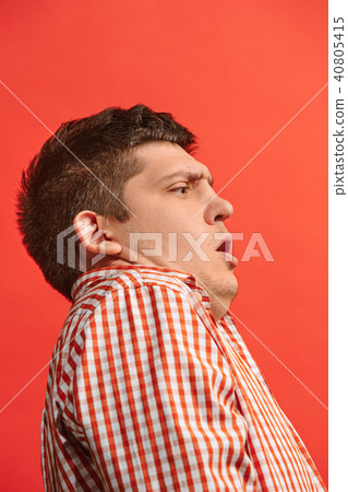 Portrait of the scared man on red 40805415